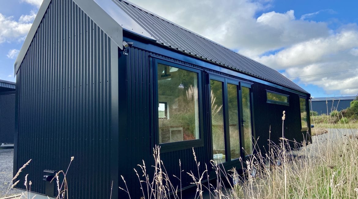 The Everest XL Tiny Home by Fox Cabins. Ideal for a larger Airbnb or family living. In Ebony Black Colorsteel Cladding.