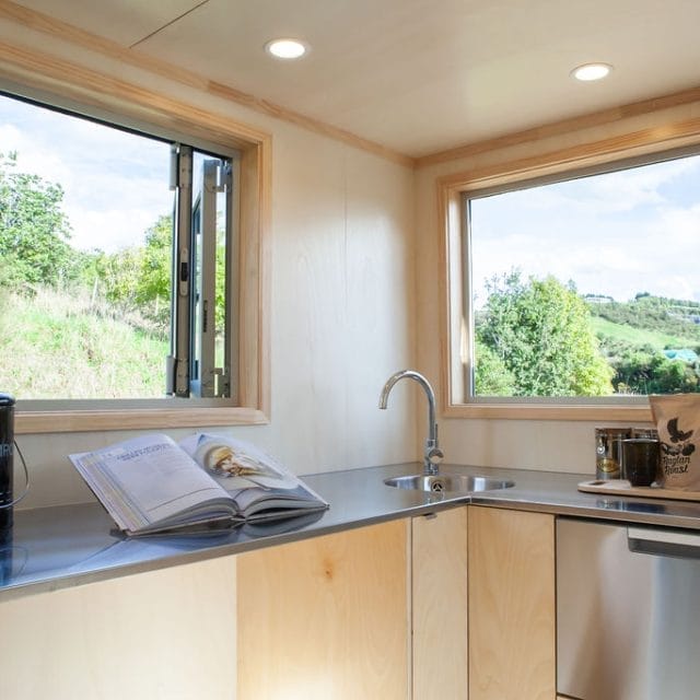 Stainless Steel Countertop in one of our custom designed Tiny Homes. All cabinetry is designed and built inhouse at our factory in Raglan.