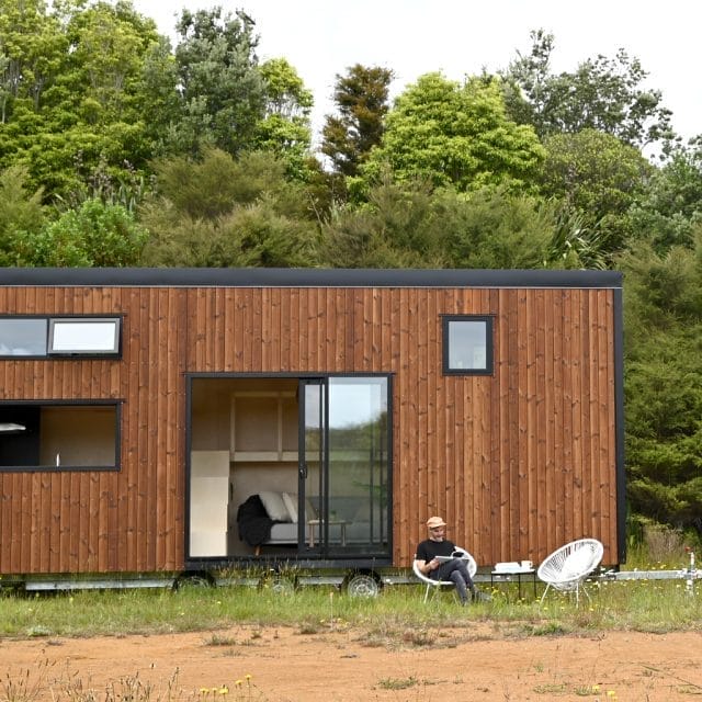 The Tasman XL Tiny Home by Fox Cabins. In Timberline Nordic Pine and Ebony Black Colorsteel Cladding.