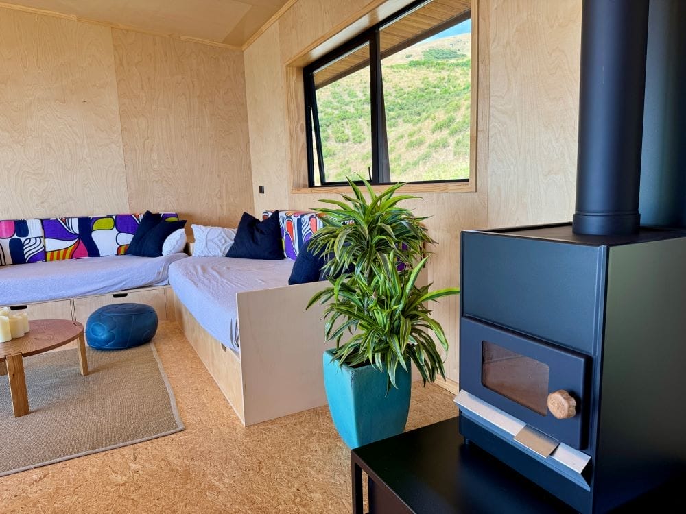 Fireplace and Livingroom of The Bach Two Bedroom Modular Home by Fox Cabins