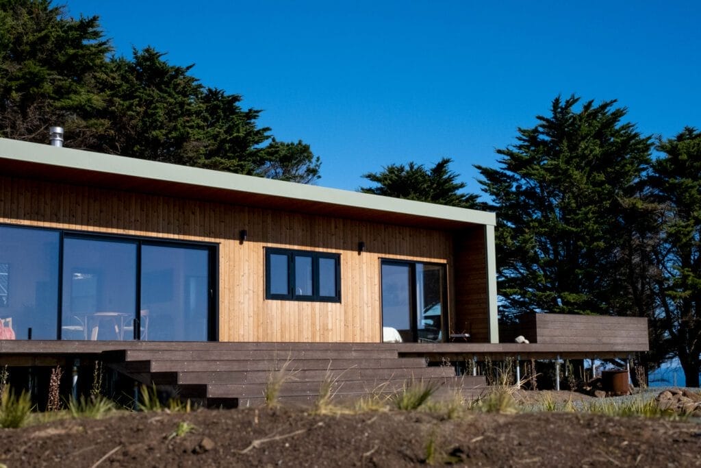 'The Bach' comes in One, Two and Three Bedroom designs. These Homes meet the 70m2 Granny Flat Regulations. Nordic Pine and Colorsteel Cladding. These prefabricated modular homes are built in Raglan.