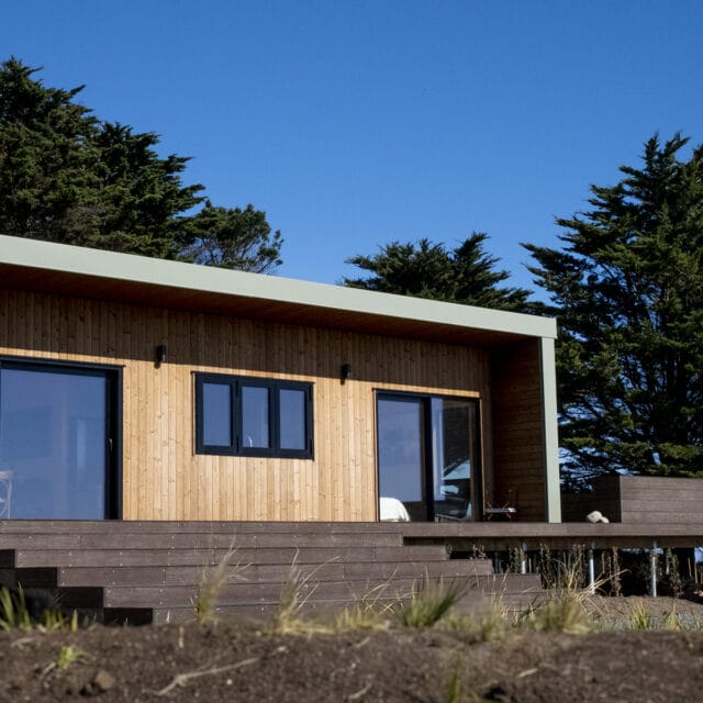 'The Bach' comes in One, Two and Three Bedroom designs. These Homes meet the 70m2 Granny Flat Regulations. Nordic Pine and Colorsteel Cladding. These prefabricated modular homes are built in Raglan.